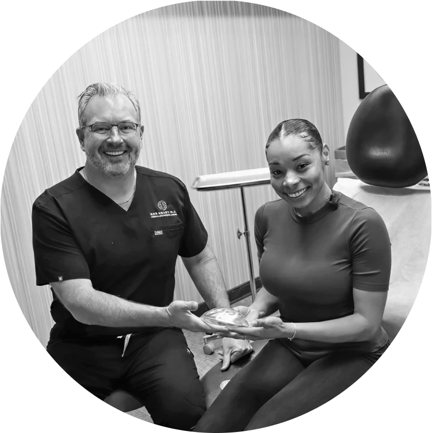 Ken Smart M.D. with patient holding implant