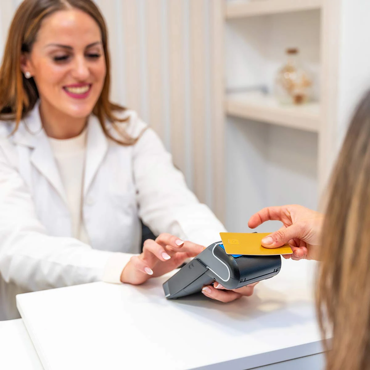 woman paying by credit card