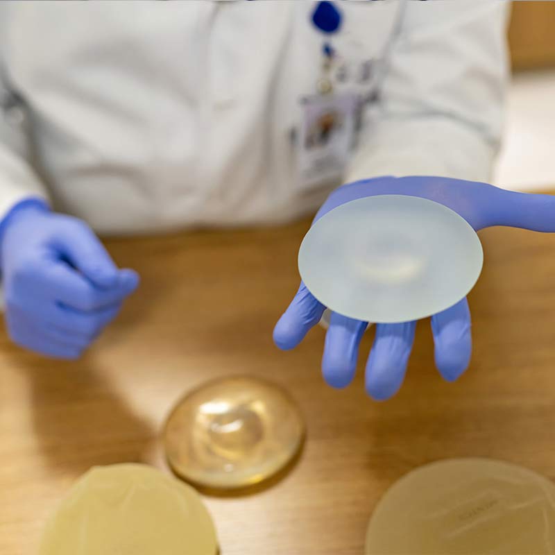 Patient looking at types of implants