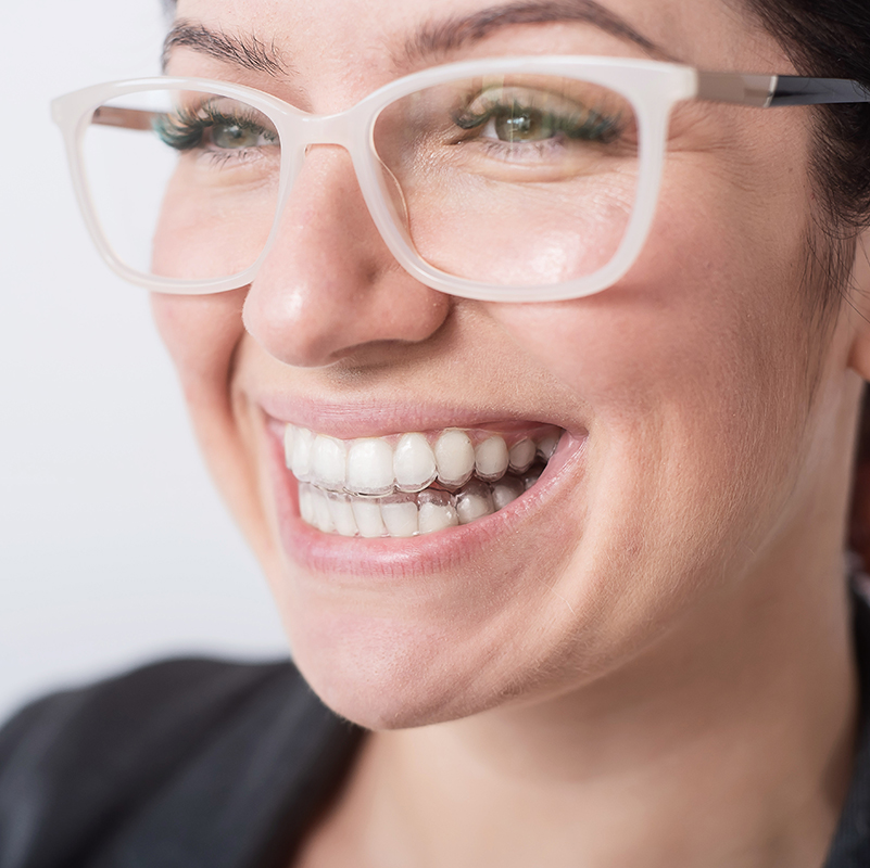 woman wearing clear aligners
