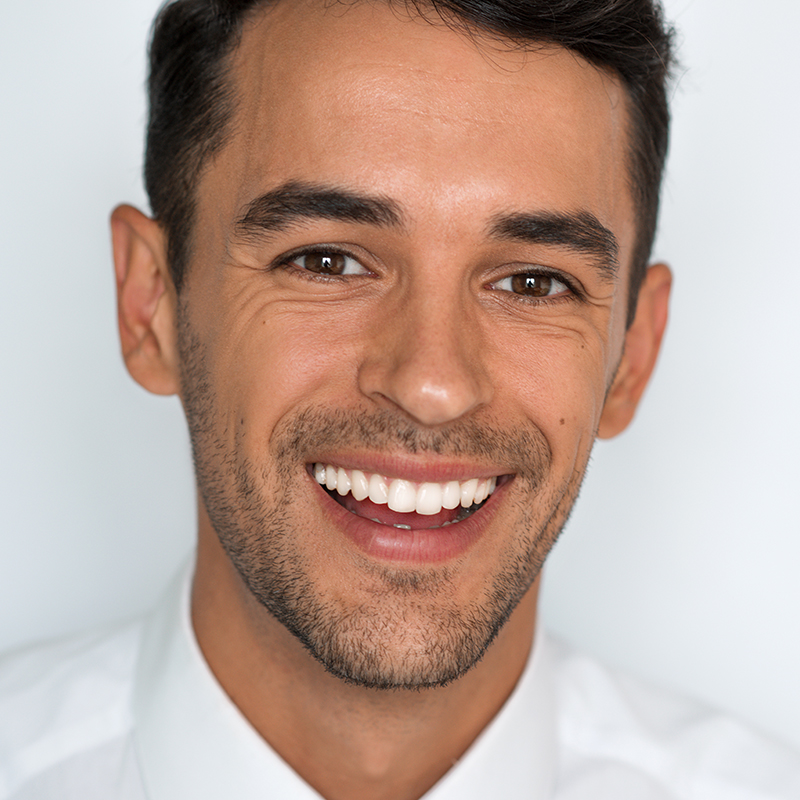 Young man smiling after Cosmetic Dentistry