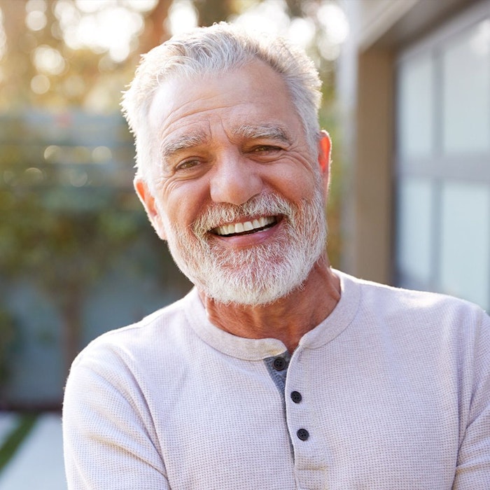 An older man with a healthy smile