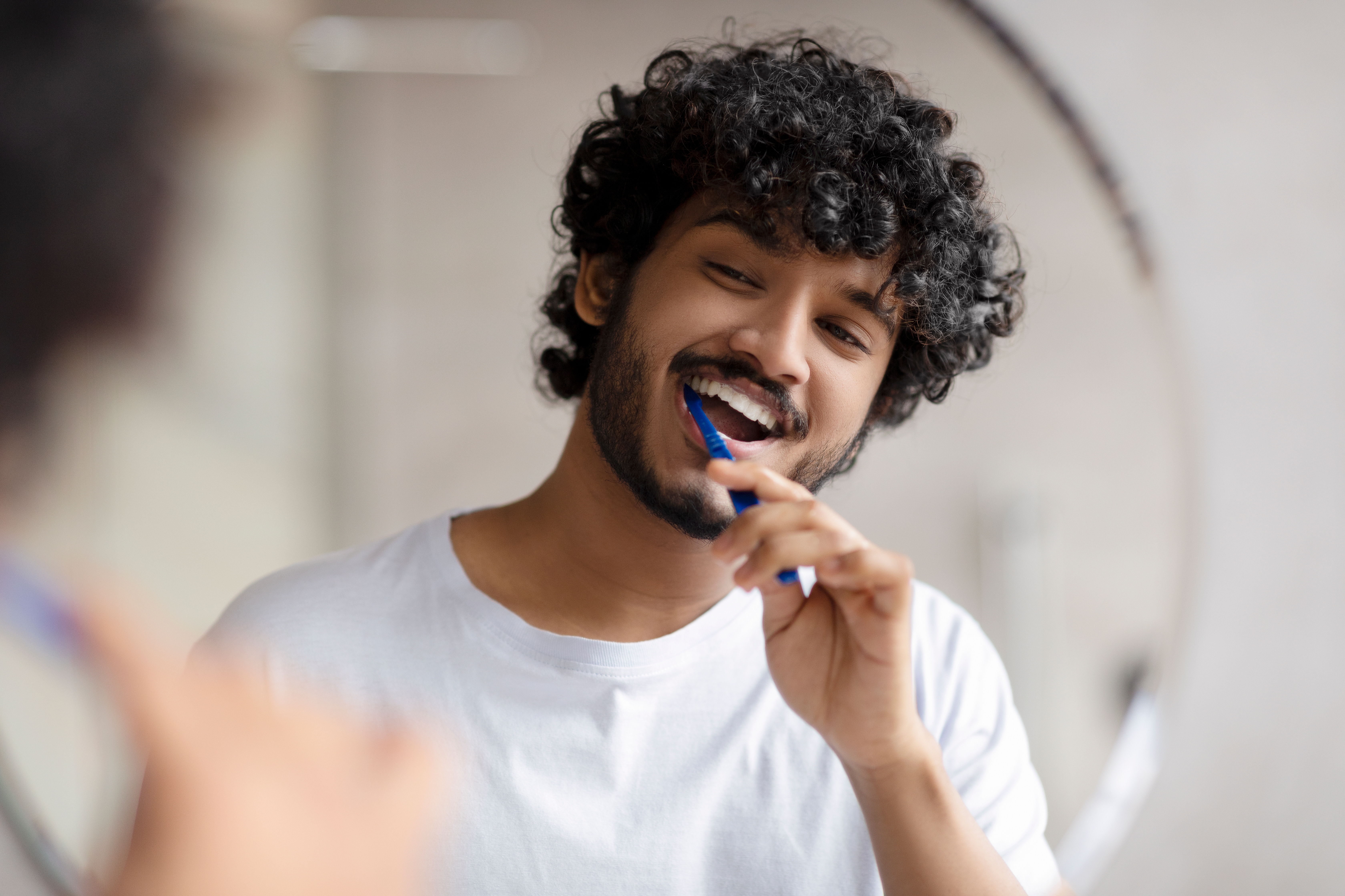 A man brushing his teeth
