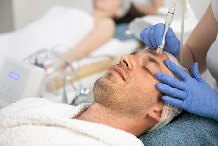 man undergoing a dermabrasion treatment