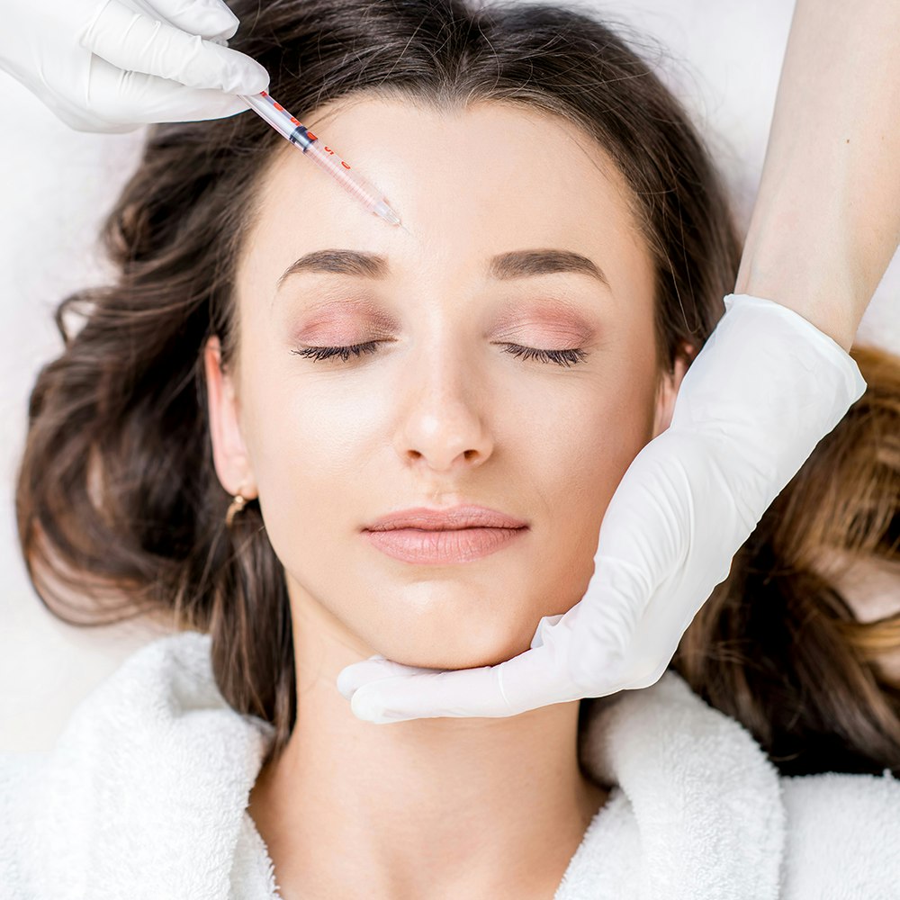 A woman getting a cosmetic injection