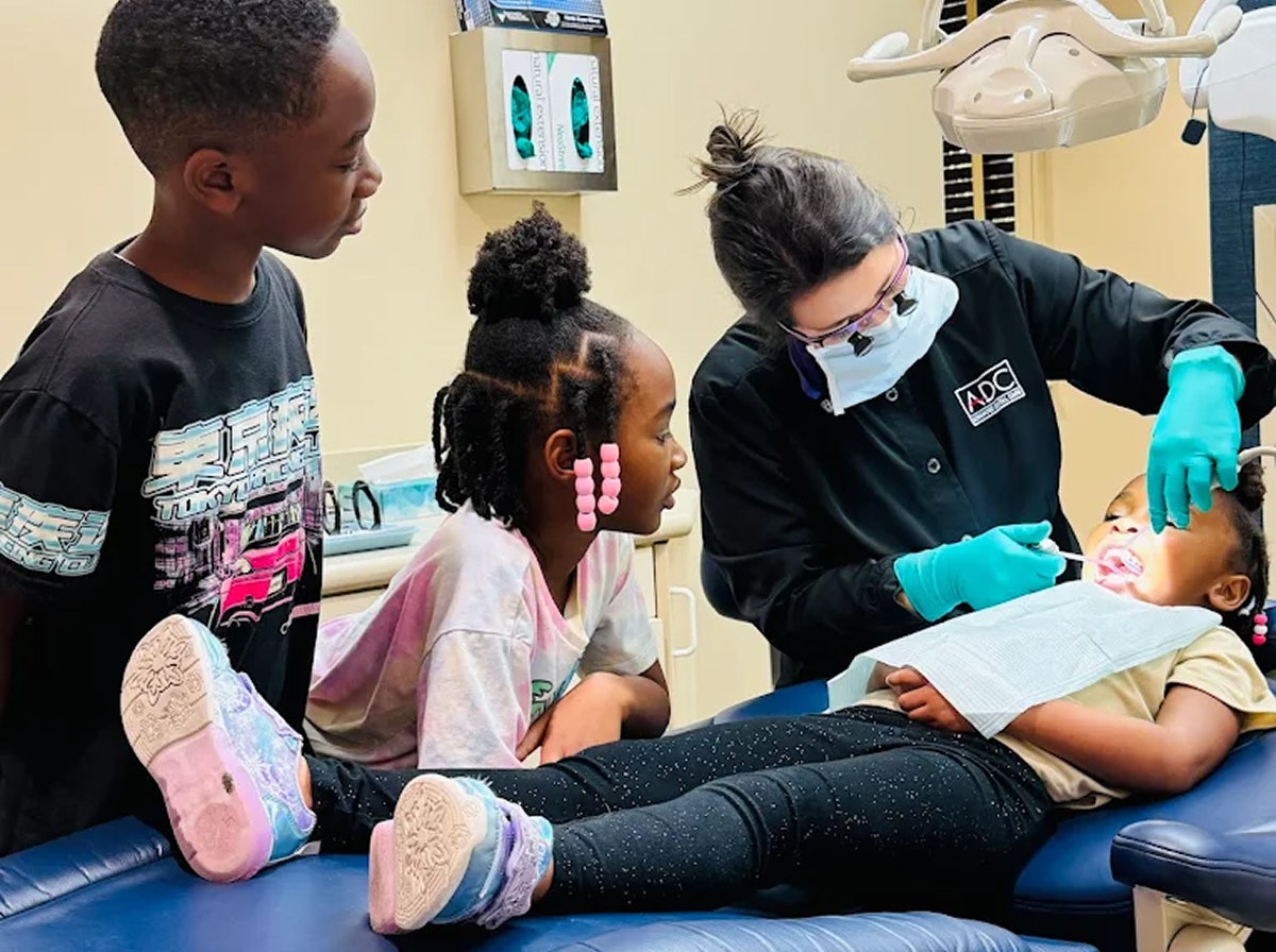 Children getting mouth examination at Advanced Dental Care
