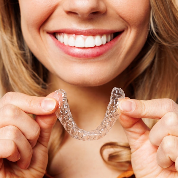 Woman holding retainer