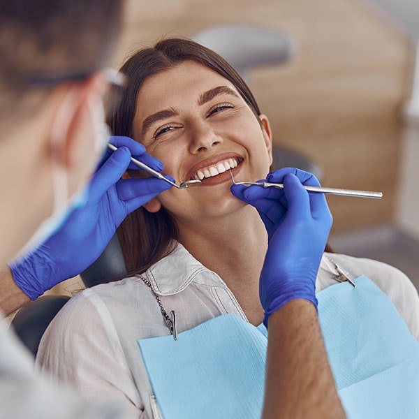 Young woman in dental chair getting a checkup