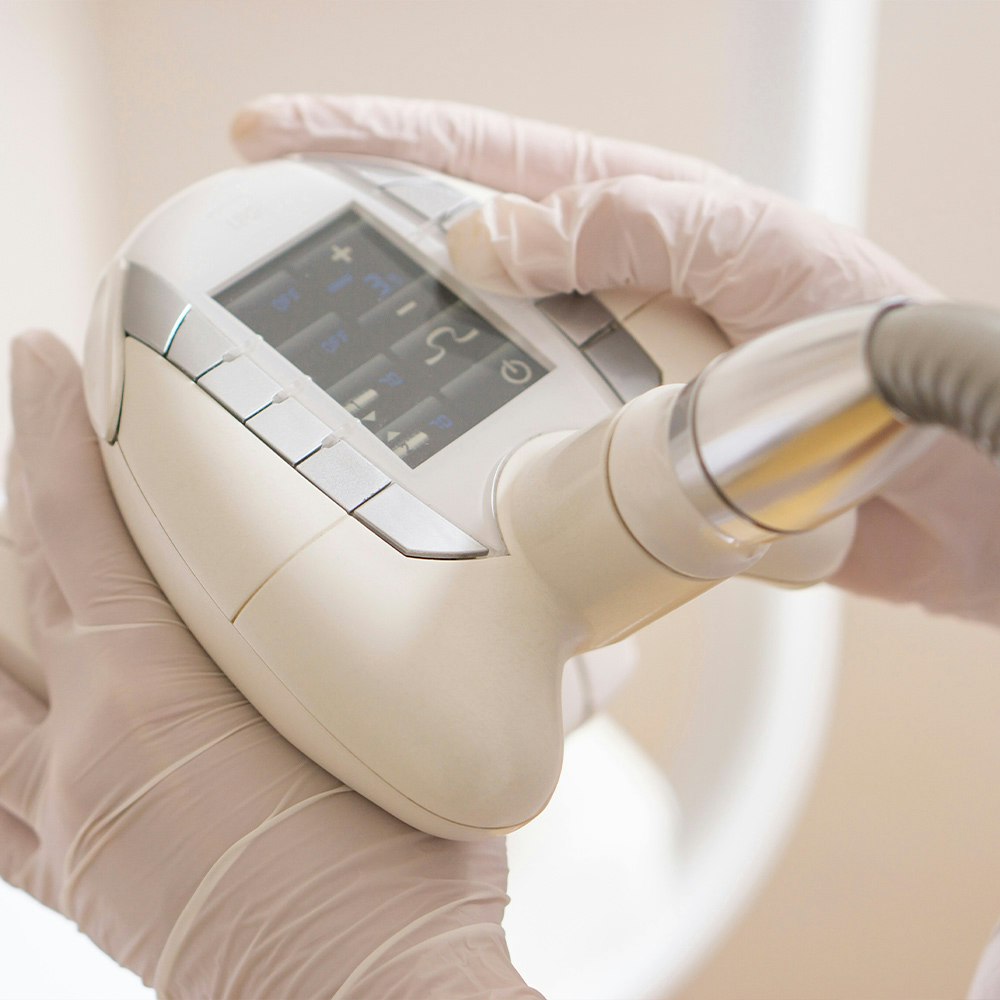 esthetician holding endermologie cellulite treatment device