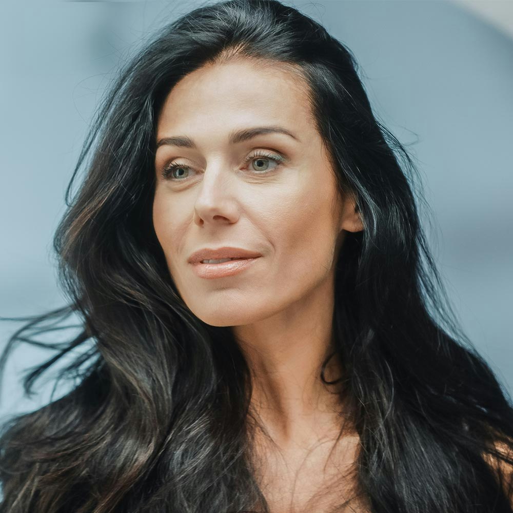 woman looking in mirror