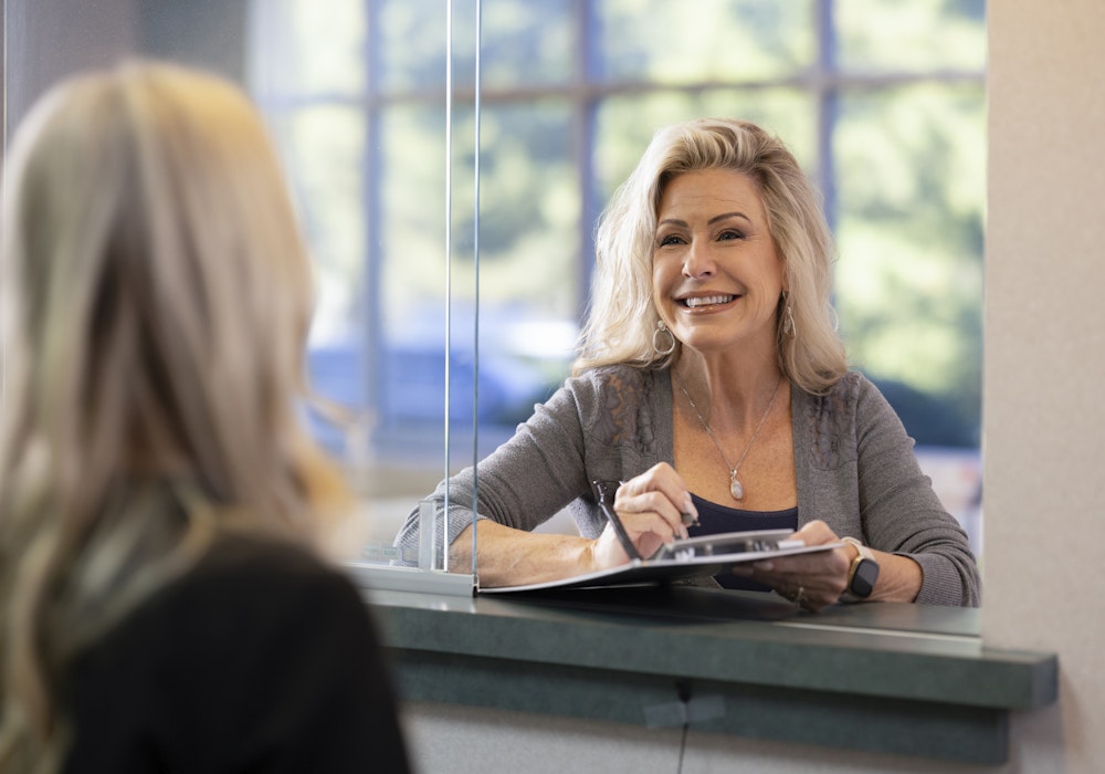 smiling patient filling out paperwork
