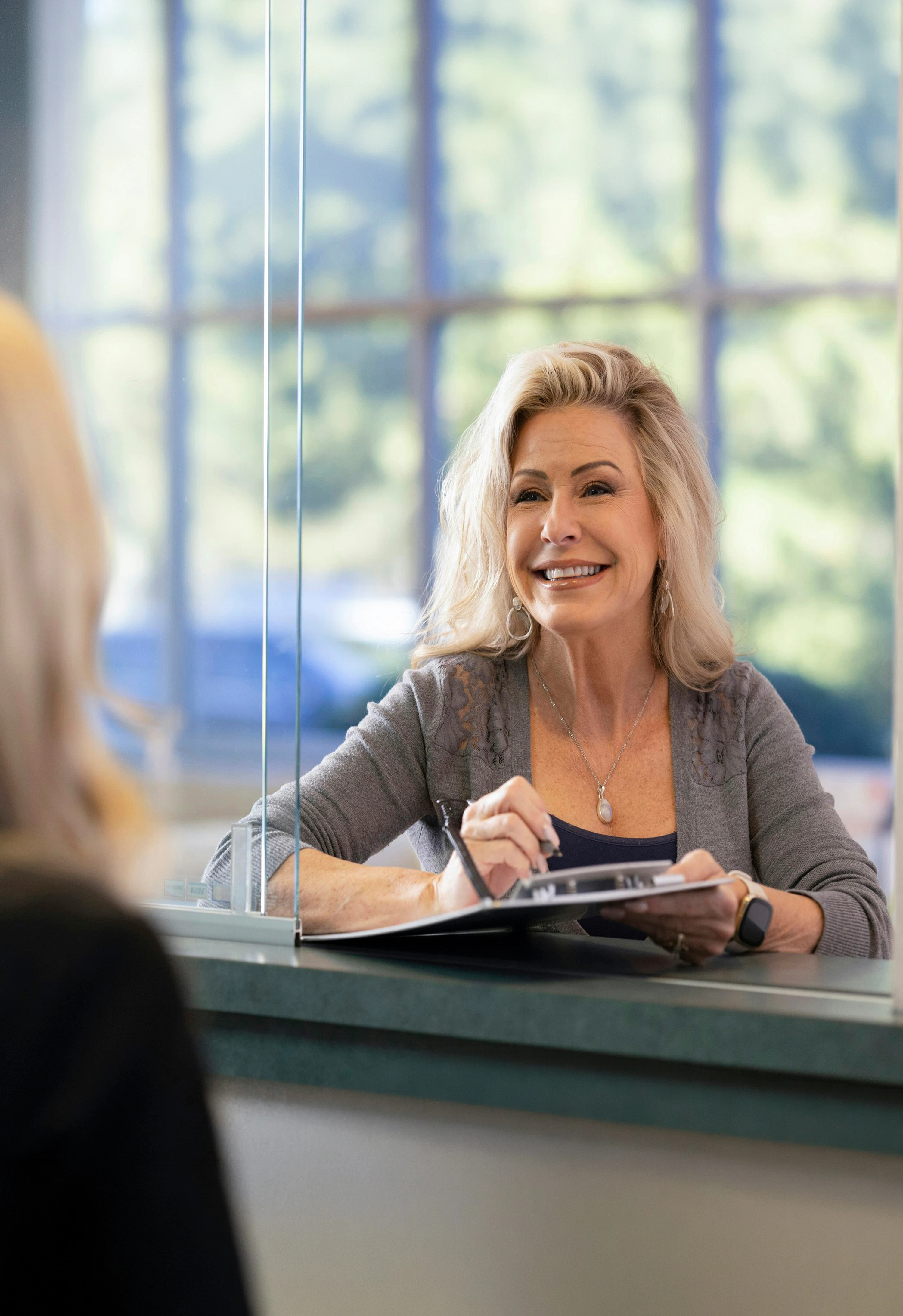 woman at checkout desk