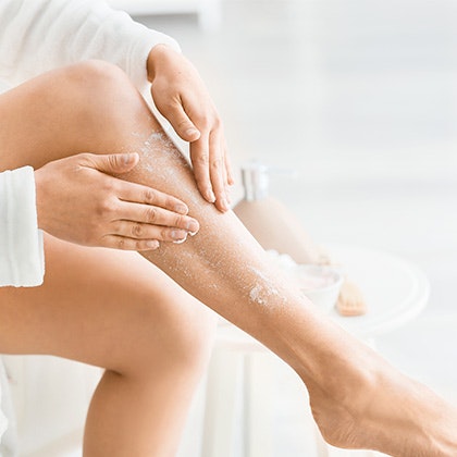 Woman Exfoliating Leg