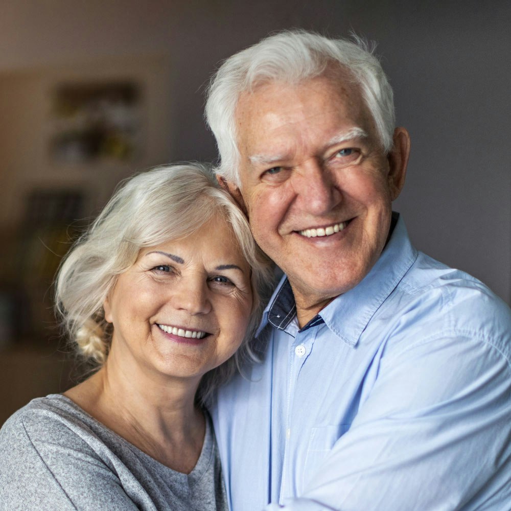 Smiling elderly couple