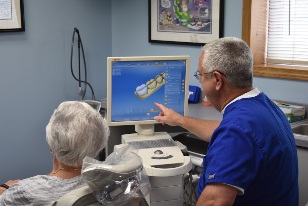 Dr. Lande and patient looking at digital scan