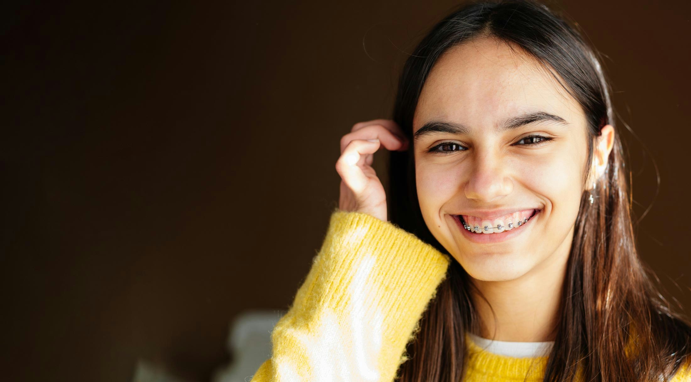 Young person with traditional braces
