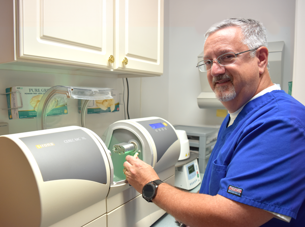 Dr. Lande with CEREC machine