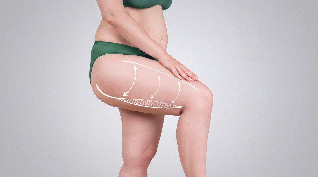 Woman standing with leg lifted