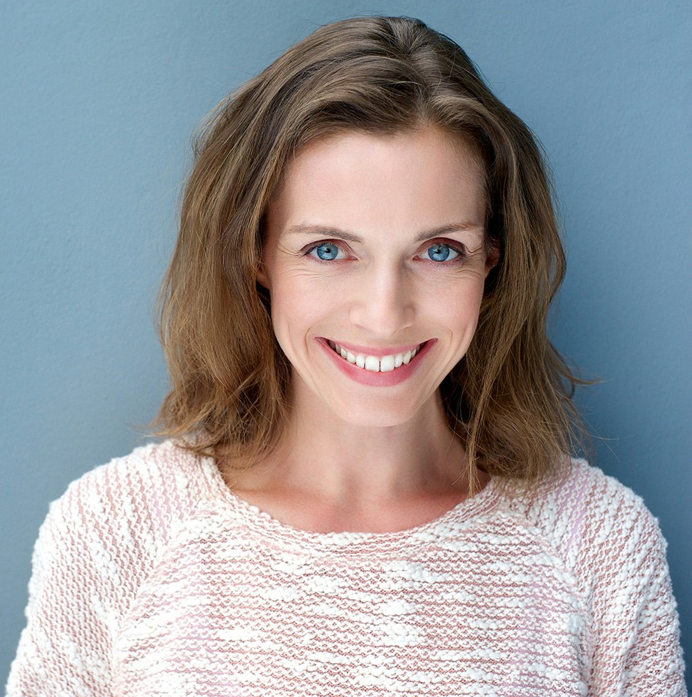 Smiling woman with dental implants