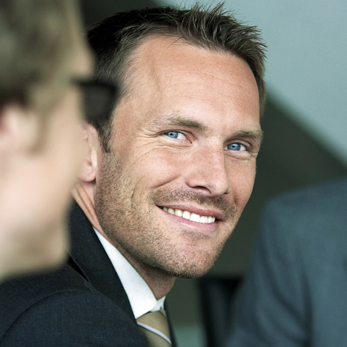 Woman smiling over her shoulder