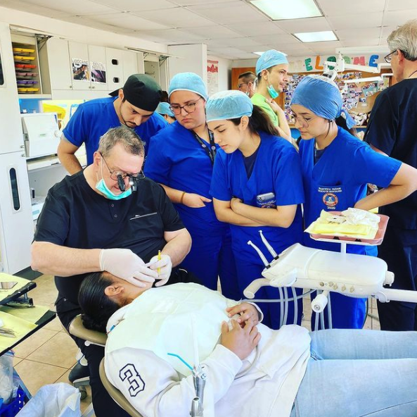 Dr. Heringer demonstrating technique to team