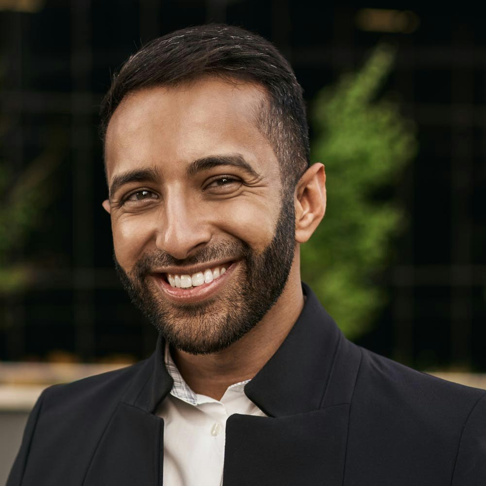 Young man smiling after gum disease is gone
