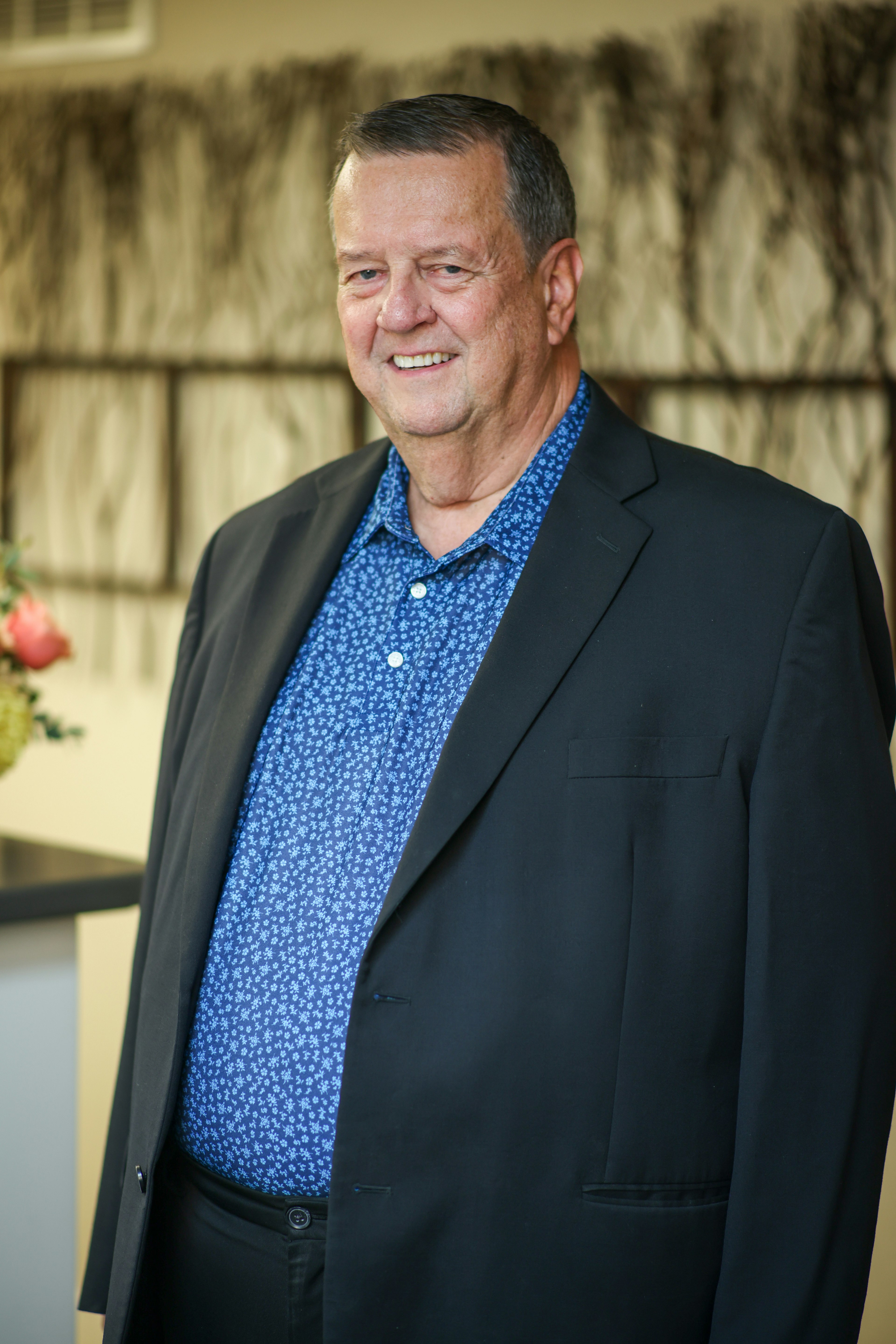 Dr. Everett Heringer treating a smiling young boy giving a thumbs up