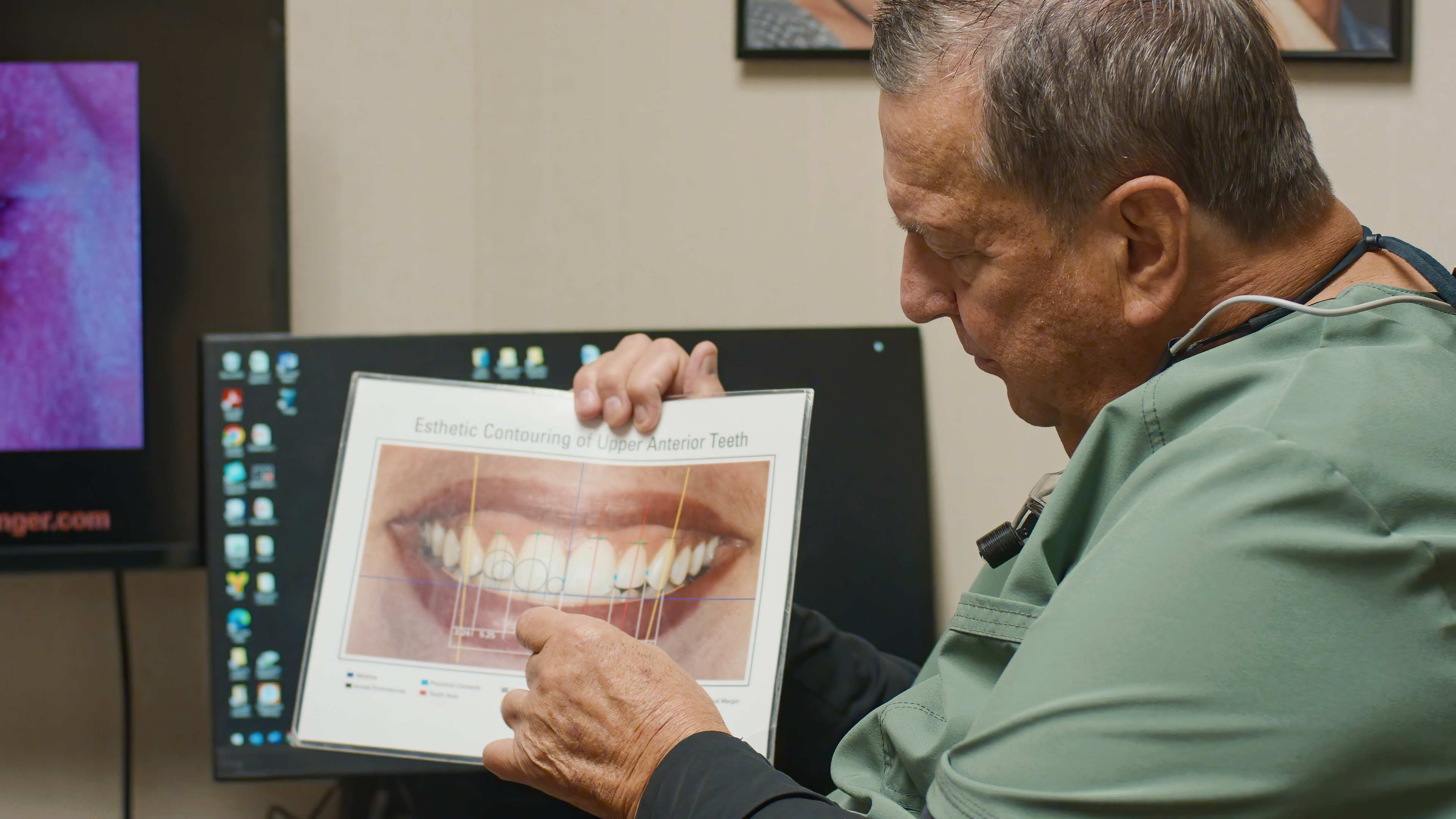 Dr. Heringer looking at a smile diagram