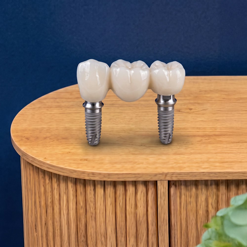 Dental bridge on wooden table