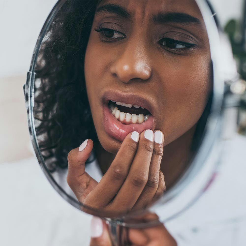 Woman looking at her tooth