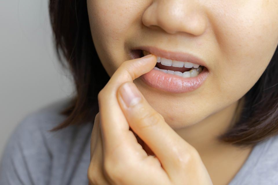 Woman looking at tooth