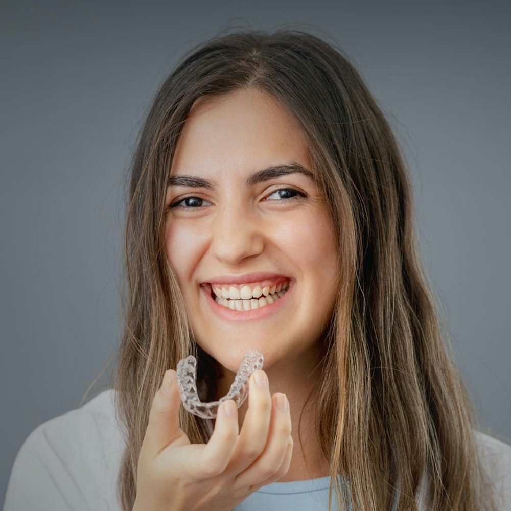 Man holding Invisalign