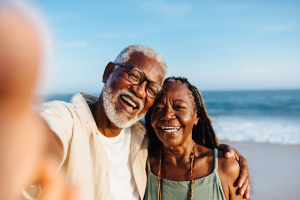 Smiling senior couple with partial dentures