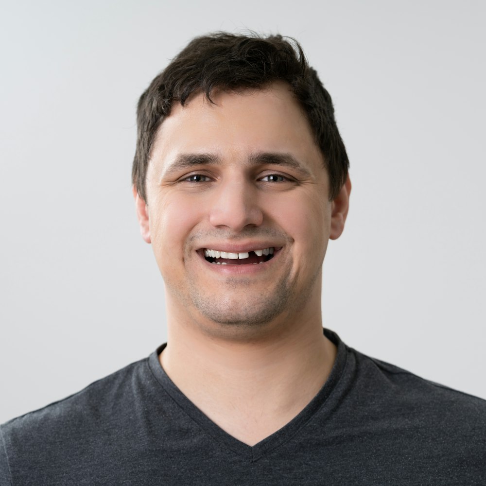 Man smiling with missing tooth