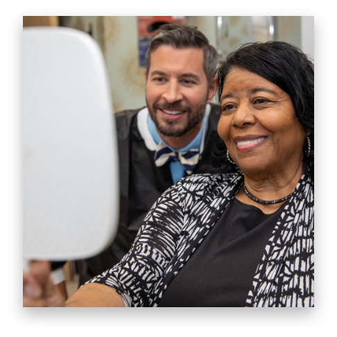 Smiling implant patient with Dr. Collier