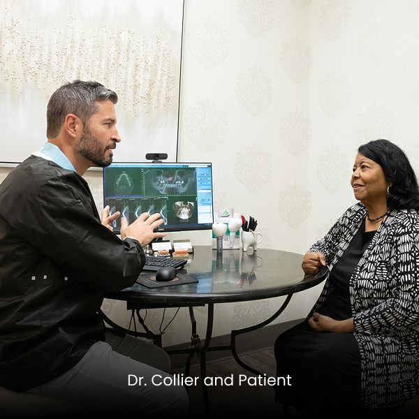 Dr. Collier with a patient