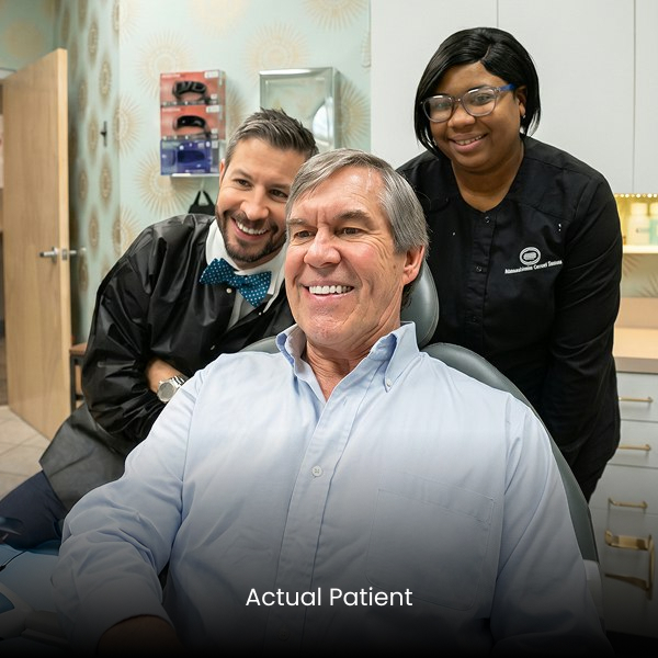 Photo of actual patient with Dr. Collier and dental team
