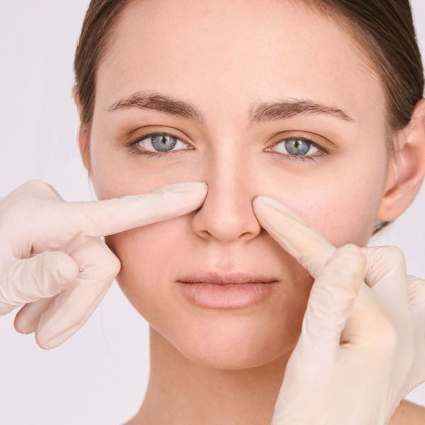 Woman getting her nose looked at