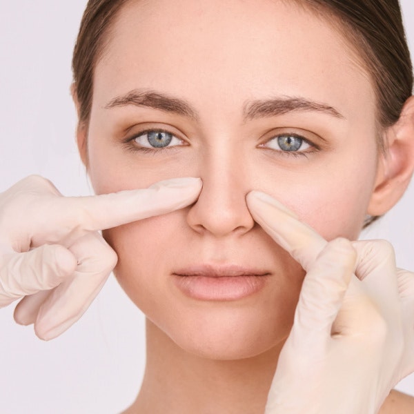 Woman getting her nose looked at