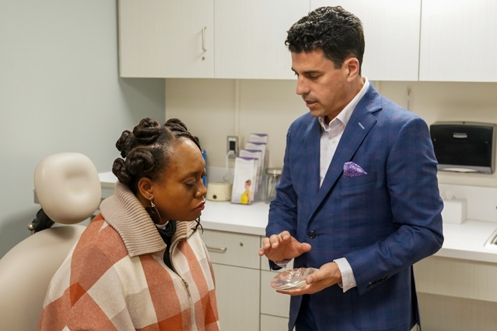 Dr. Lerman showing breast implants to patient