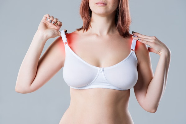 woman experiencing shoulder pain from bra straps