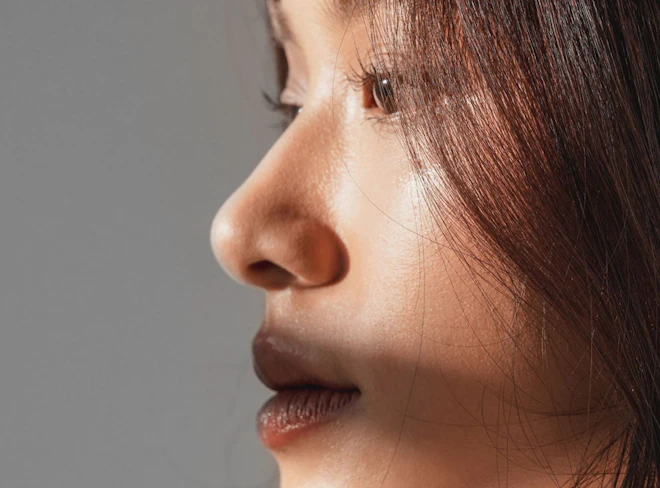 Side profile of woman’s face highlighting nose and facial contours