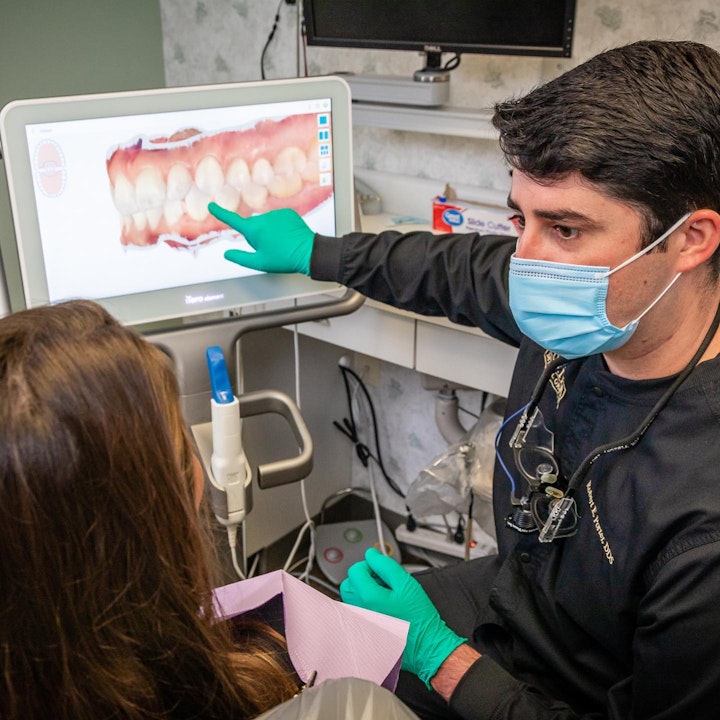 Dr. Robert Porter with client showcasing digital mockup