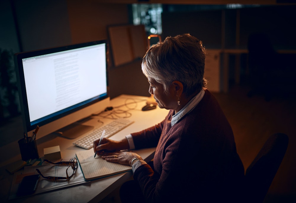 Woman working in dim lit section