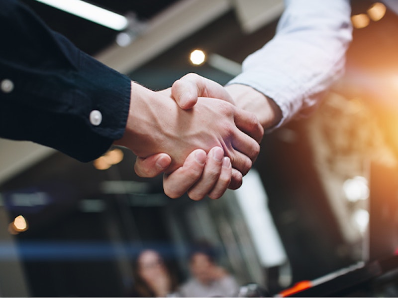 Handshake between lawyer and client