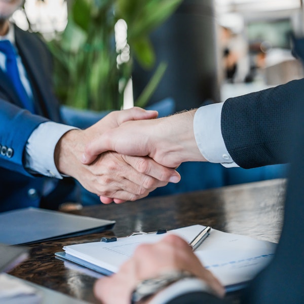 client shaking lawyer's hand