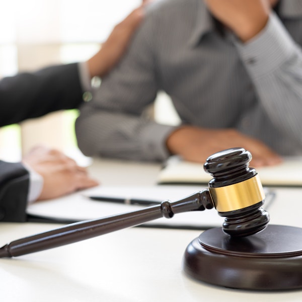 Lawyer consoling client