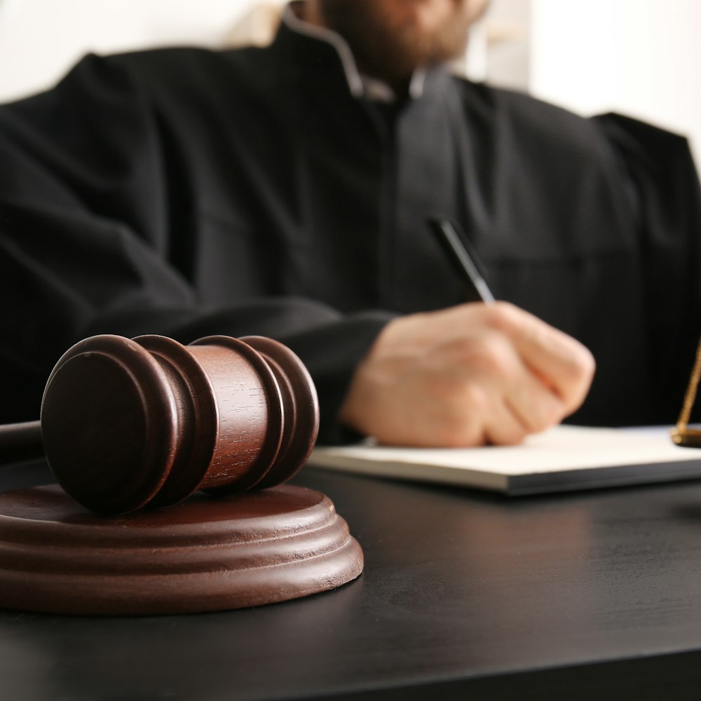 Judge signing a document