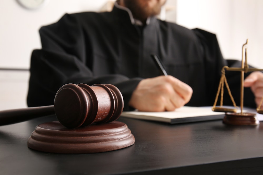 Judge signing a document