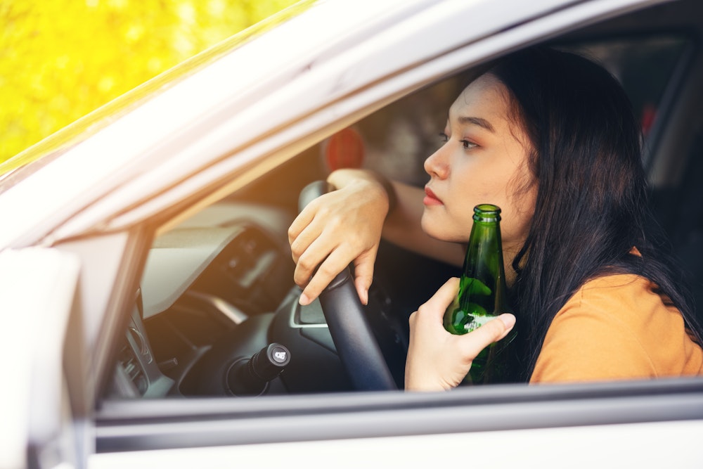 Underage woman drinking and driving